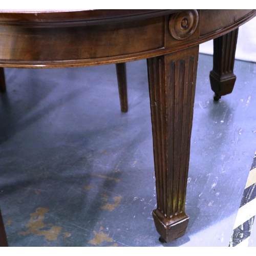 2114 - A 20th century mahogany dining table in the Regency style, extending with three additional leaves an... 