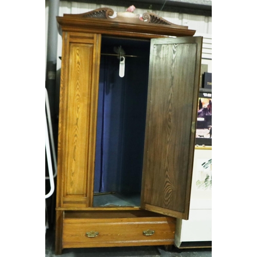 2116 - An early 20th century golden oak single door mirrored wardrobe, 120 x 52 x 210 cm H. Not available f... 