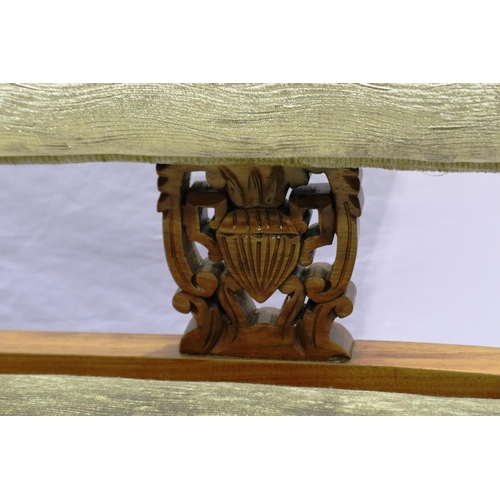 2117 - An Edwardian walnut framed two-seat settee, with carved and later upholstered back-rest and overstuf... 