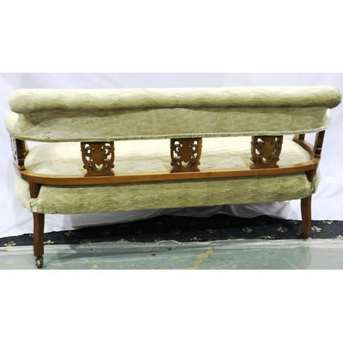 2117 - An Edwardian walnut framed two-seat settee, with carved and later upholstered back-rest and overstuf... 