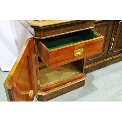 2118 - 19th century walnut sideboard, with inverted break-front, having four panelled doors and cellarette ... 