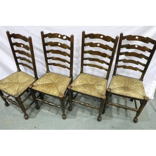 2121 - Four ladder back country oak kitchen chairs with rushed seats and ball feet. Not available for in-ho... 