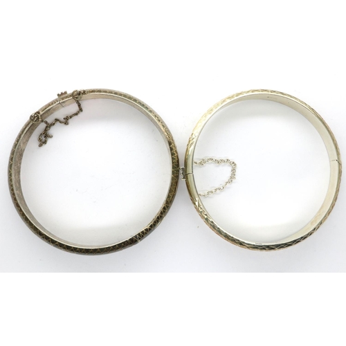 14 - Two 925 silver bangles with safety chains, largest D: 70 mm. P&P Group 1 (£14+VAT for the first lot ... 