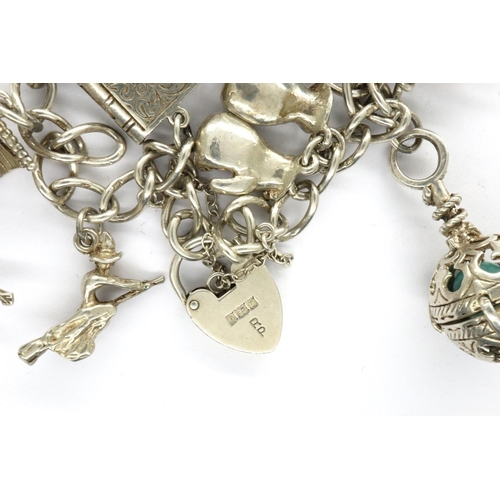 20 - 925 silver charm bracelet with hallmarked silver padlock clasp, safety chain and ten charms, L: 18 c... 