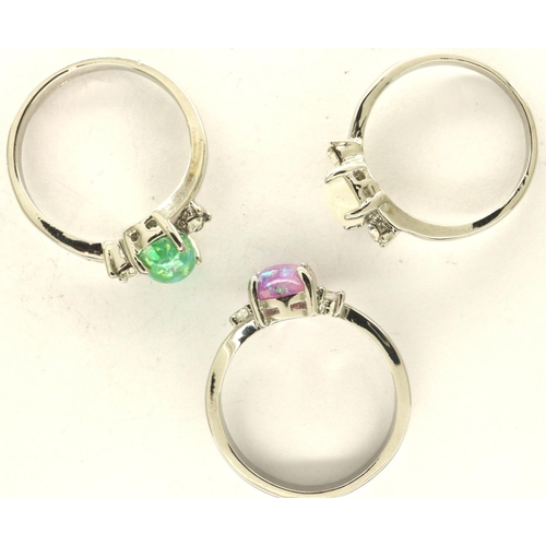 55 - Three opalescent stone set silver rings, sizes P-S. P&P Group 1 (£14+VAT for the first lot and £1+VA... 