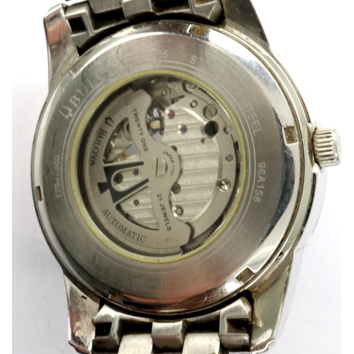 94 - BULOVA: gents steel cased automatic wristwatch, with circular black dial, visible escapement and ste... 