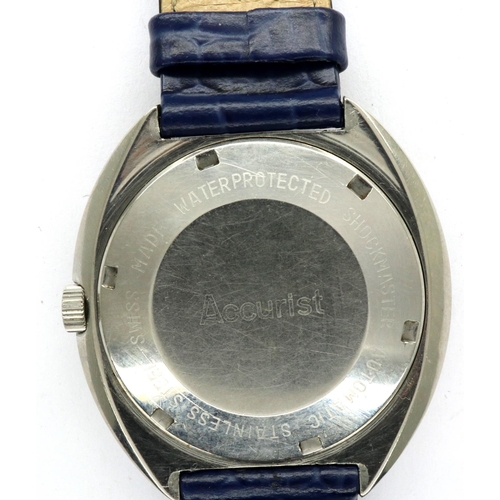 133 - ACCURIST: gents steel cased automatic wristwatch, with circular champagne dial, date aperture and bl... 