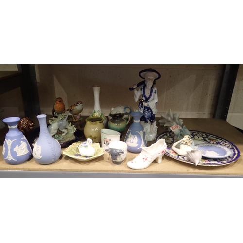 1039 - Large collection of ceramics to include Wedgwood and figurines. Not available for in-house P&P