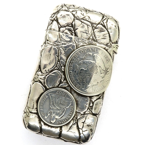 172 - Sterling silver vesta case embossed with an American silver half dollar, a quarter dollar and silver... 