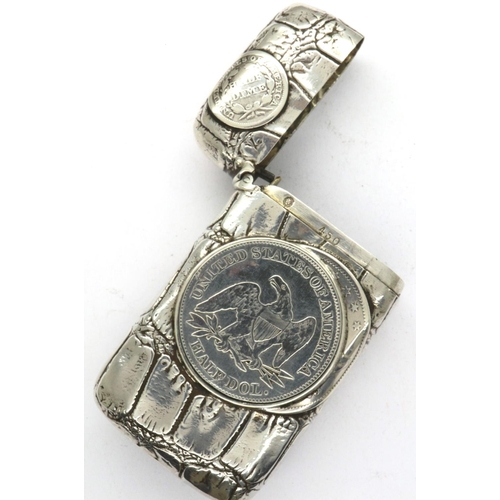 172 - Sterling silver vesta case embossed with an American silver half dollar, a quarter dollar and silver... 