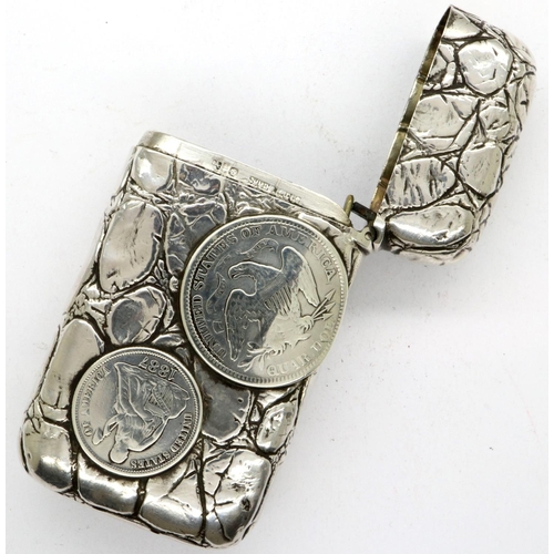 172 - Sterling silver vesta case embossed with an American silver half dollar, a quarter dollar and silver... 