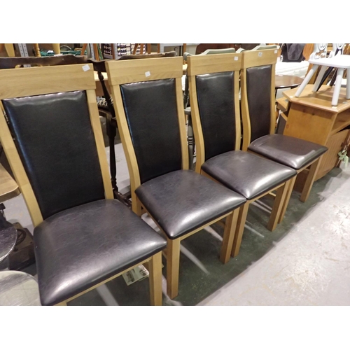 1472 - Four faux leather dining chairs. Not available for in-house P&P