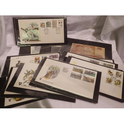 1126 - Collection of world banknotes in sleeves and first day covers. P&P Group 1 (£14+VAT for the first lo... 