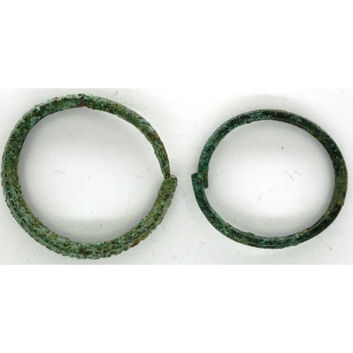 202 - Two Celtic ringlets in bronze, largest L: 30 mm. P&P Group 0 (£5+VAT for the first lot and £1+VAT fo... 