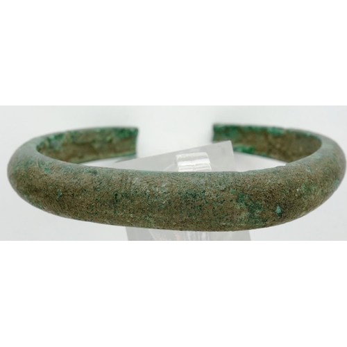 241 - 3rd century bronze bangle/torc bracelet with crude Nordic engraving, D: 60 mm. P&P Group 0 (£5+VAT f... 