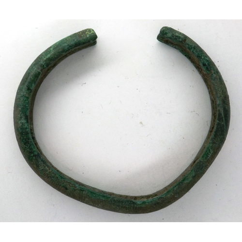 241 - 3rd century bronze bangle/torc bracelet with crude Nordic engraving, D: 60 mm. P&P Group 0 (£5+VAT f... 