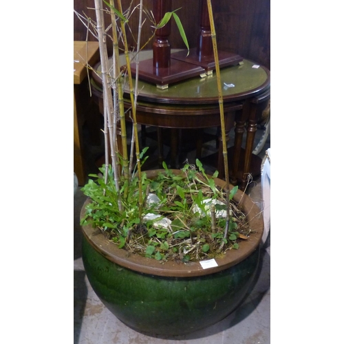 1579I - Large green glazed plant pot with bamboo, H: 250 cm. Not available for in-house P&P