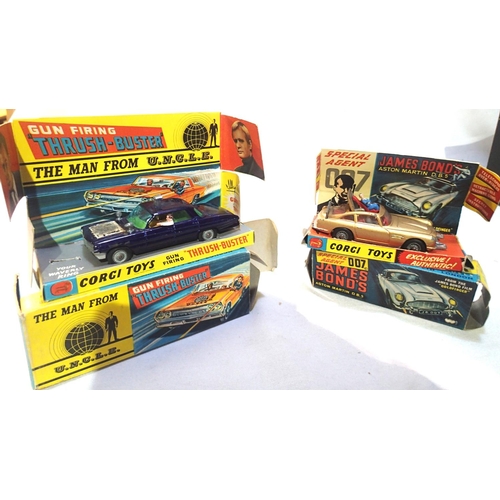 2212 - Corgi 497 man from uncle car, blue in good condition, damaged bonnet decal, minor chips, working act... 