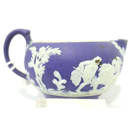 1130 - Miniature Wedgwood Jasperware jug, H: 20 mm, dark blue background with applied white figures. P&P Gr... 