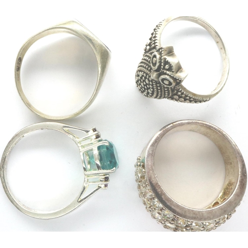 13 - Four 925 silver rings including stone set exmaples, sizes S-T. P&P Group 1 (£14+VAT for the first lo... 