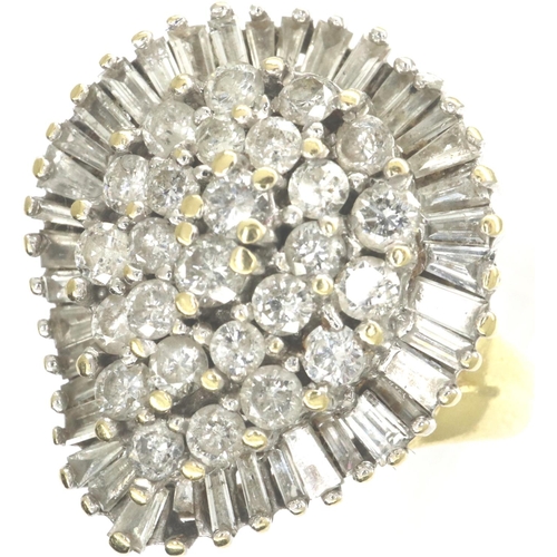 36 - 18ct gold baguette and round cut diamond set ring, size O, 9.7g. P&P Group 1 (£14+VAT for the first ... 