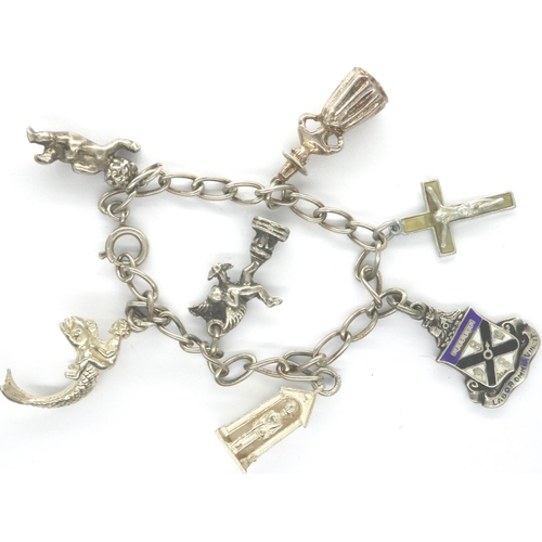 37 - 925 silver bracelet with seven charms, L: 18 cm. P&P Group 1 (£14+VAT for the first lot and £1+VAT f... 