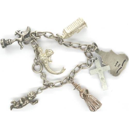 37 - 925 silver bracelet with seven charms, L: 18 cm. P&P Group 1 (£14+VAT for the first lot and £1+VAT f... 