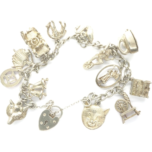 9 - 925 silver bracelet with thirteen charms padlock clasp and safety chain, L: 18 cm. P&P Group 1 (£14+... 