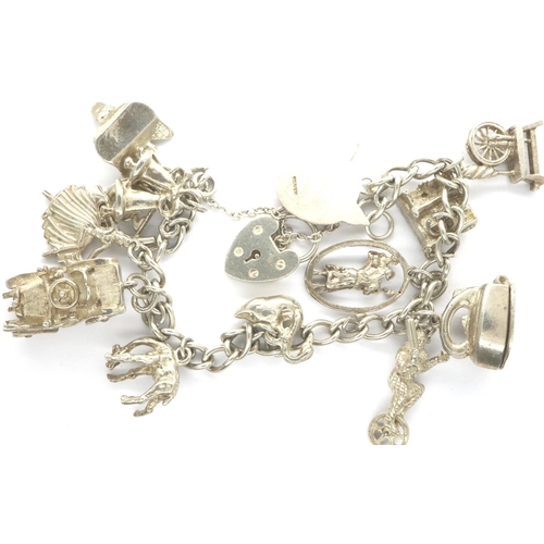 9 - 925 silver bracelet with thirteen charms padlock clasp and safety chain, L: 18 cm. P&P Group 1 (£14+... 