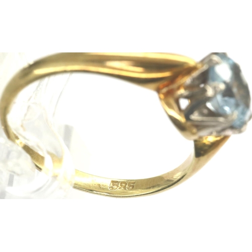 62 - 14ct gold ring set with a central topaz, marked 585, size L, 2.9g. P&P Group 1 (£14+VAT for the firs... 