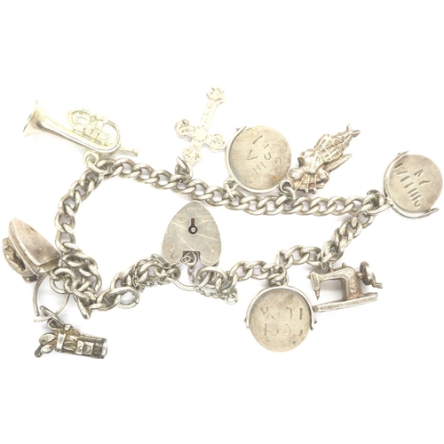 75 - Hallmarked silver charm bracelet with nine charms and hallmarked clasp and safety chain, L: 18 cm, 2... 