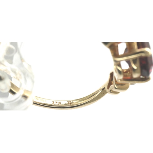 78 - 9ct gold garnet and diamond trilogy ring, size N/O, 2.4g. P&P Group 1 (£14+VAT for the first lot and... 