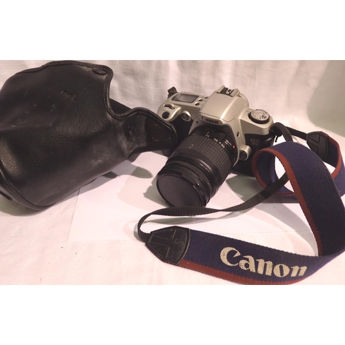 1123 - Canon EOS camera, with strap and case. P&P Group 1 (£14+VAT for the first lot and £1+VAT for subsequ... 