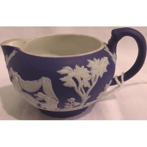 1130 - Miniature Wedgwood Jasperware jug, H: 20 mm, dark blue background with applied white figures. P&P Gr... 