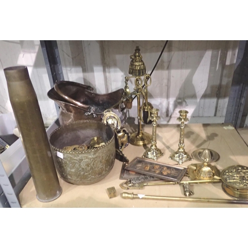 1174 - Collection of mixed metalware including candlesticks and an artillery shell. Not available for in-ho... 