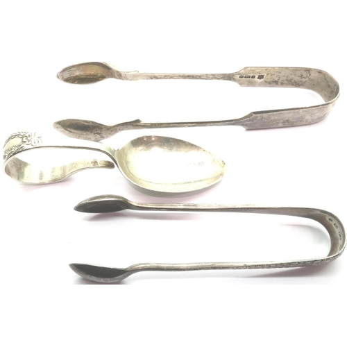 141 - Two pairs of hallmarked silver sugar tongues and a christening spoon, all Birmingham assay, combined... 