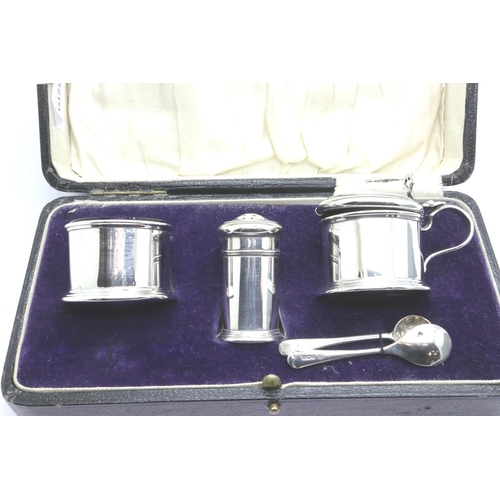 154 - Adie Brothers, George V hallmarked silver three piece cruet set, with blue glass liners, Birmingham ... 