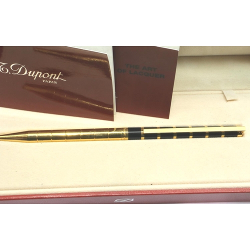 175 - Dupont of Paris gold plated and black lacquer ballpoint pen, boxed, with papers and refill. P&P Grou... 