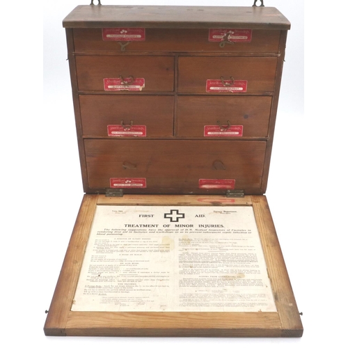 179 - An early 20th century oak wall mounting first aid box, fitted with drawers and contents, 40 x 37 x 1... 