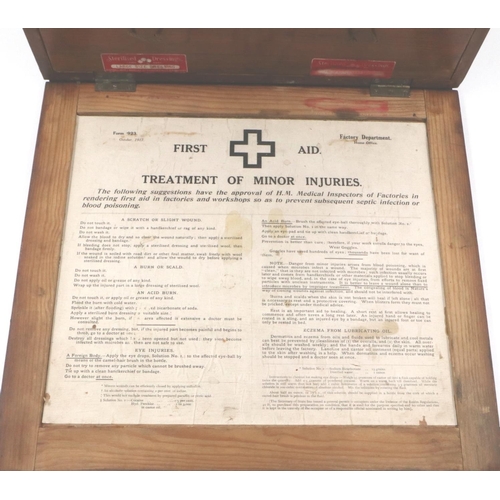 179 - An early 20th century oak wall mounting first aid box, fitted with drawers and contents, 40 x 37 x 1... 