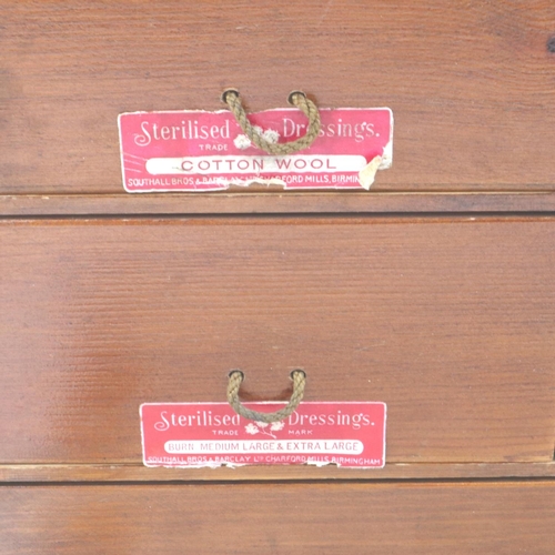 179 - An early 20th century oak wall mounting first aid box, fitted with drawers and contents, 40 x 37 x 1... 