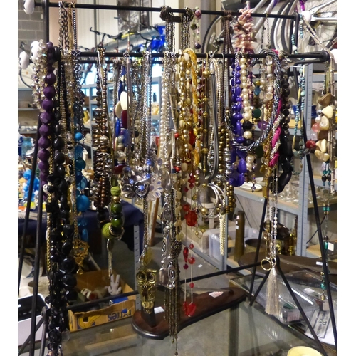 1133A - Mixed costume jewellery necklaces, mainly bead examples, on a display stand. Not available for in-ho... 