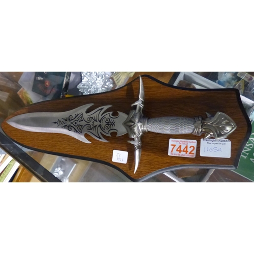 1165A - Stainless steel fantasy knife on a wooden display stand. Not available for in-house P&P