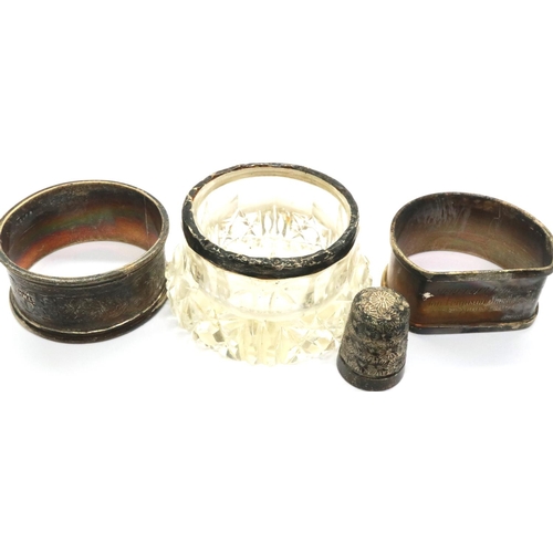 160 - Two silver napkin rings, a silver covered pot and a silver no 17 thimble. P&P Group 1 (£14+VAT for t... 