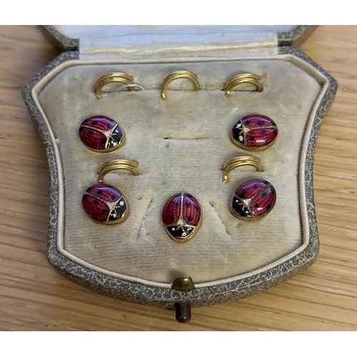 1075A - Boxed set of five enamel and gilt studs. P&P Group 1 (£14+VAT for the first lot and £1+VAT for subse... 