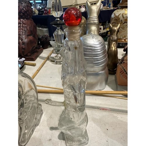 1351 - Six spirit decanters in the forms of devils, Buddha etc. Minor losses to poison bottle, others appea... 