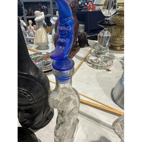 1351 - Six spirit decanters in the forms of devils, Buddha etc. Minor losses to poison bottle, others appea... 