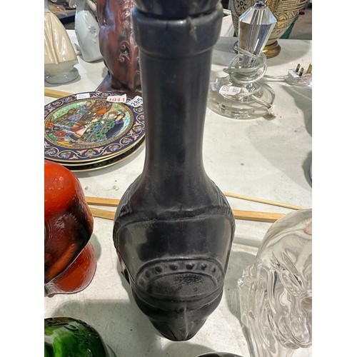 1351 - Six spirit decanters in the forms of devils, Buddha etc. Minor losses to poison bottle, others appea... 