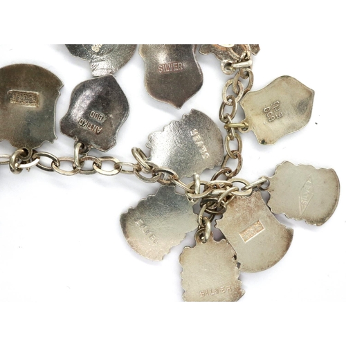 9 - 925 silver charm bracelet with seventeen charms, L: 18 cm. P&P Group 1 (£14+VAT for the first lot an... 