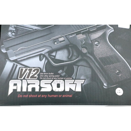 2021 - New old stock airsoft pistol, model V12 in brown, boxed. P&P Group 2 (£18+VAT for the first lot and ... 